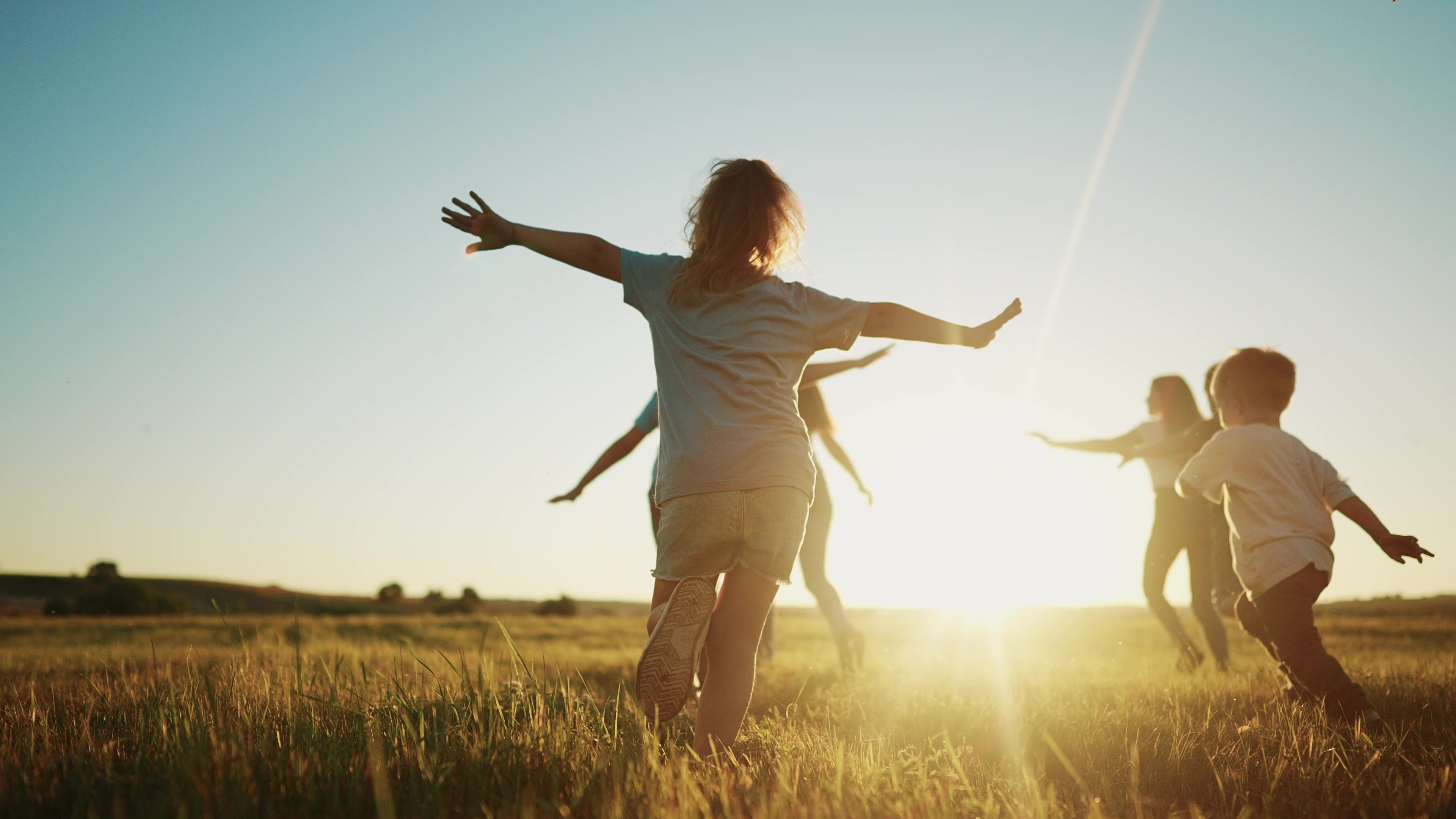 Kids running in a field